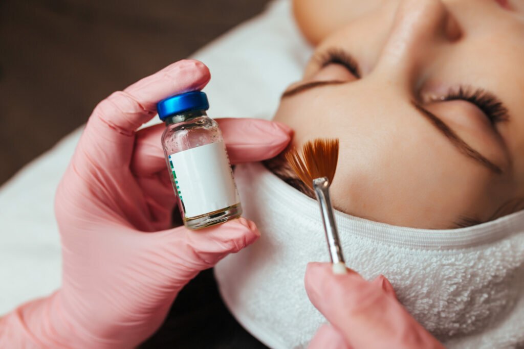In the hands of a brush and a container with the drug, cosmetology chemical peeling | Soul Aesthetics in Tulsa, OK