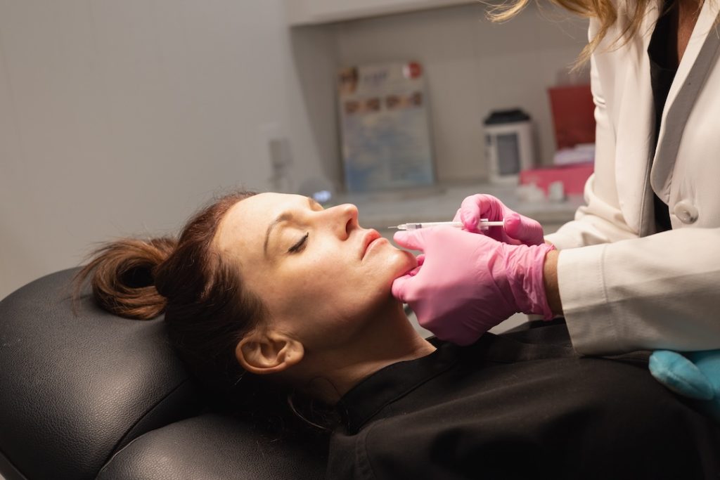 woman receiving dermal fillers for a natural glow