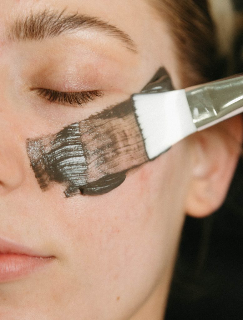 woman receiving a facial for wrinkle, acne, and all over glow