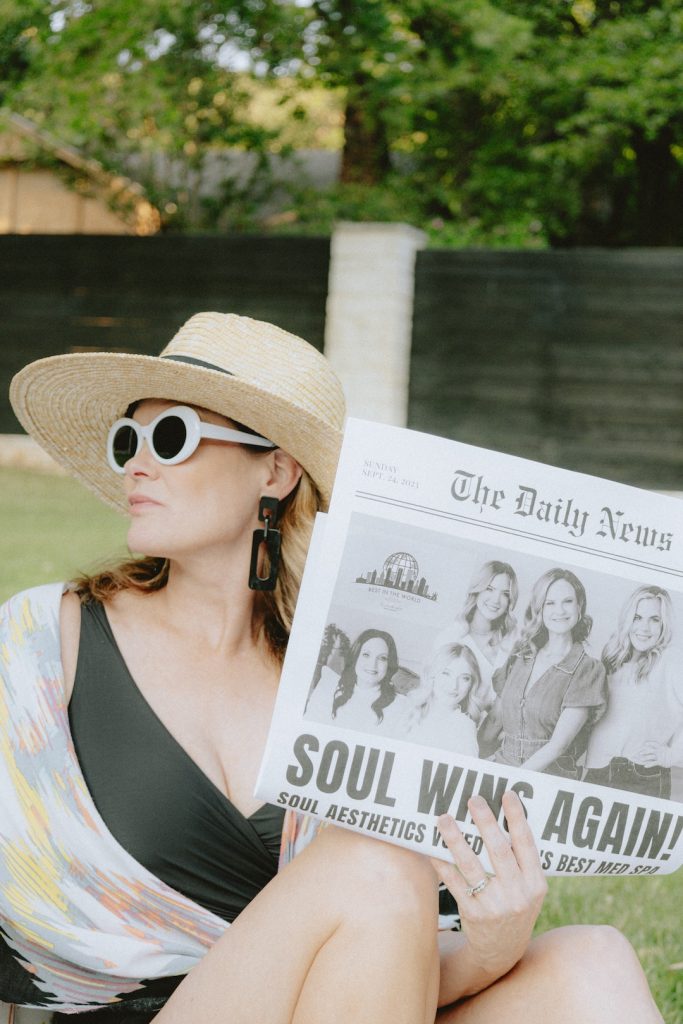 woman with newspaper about the truth about a beauty journey for women